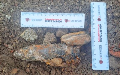 40mm Bofors round (with rulers for scale) which was discovered on a development site in Portsmouth by 1st Line Defence.