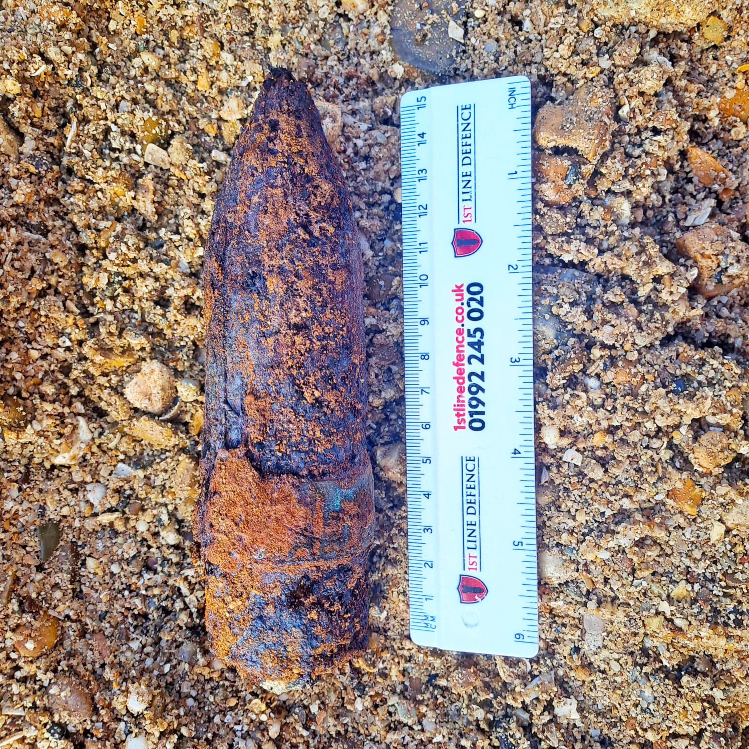 40mm Bofors round (with rulers for scale) which were discovered on a development site in Southampton by 1st Line Defence.